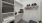 Interior closet space, carpet flooring, ceiling light, built-in shelving