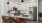 Kitchen with Breakfast bar Counter with cabinet space, ceiling lighting, stainless steel appliances