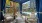 Exterior building with plam trees, cabanas, outdoor lounge seating, swimming pool
