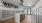Interior mailroom, hardwood flooring, ceiling lighting
