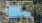 Birds-eye view of the resort-style pool, palm trees, outdoor lounge seating