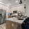 Kitchen with Breakfast bar Counter with cabinet space, ceiling lighting, stainless steel appliances