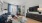 Interior living room, hardwood flooring, furnished model, large window, door leading to patio