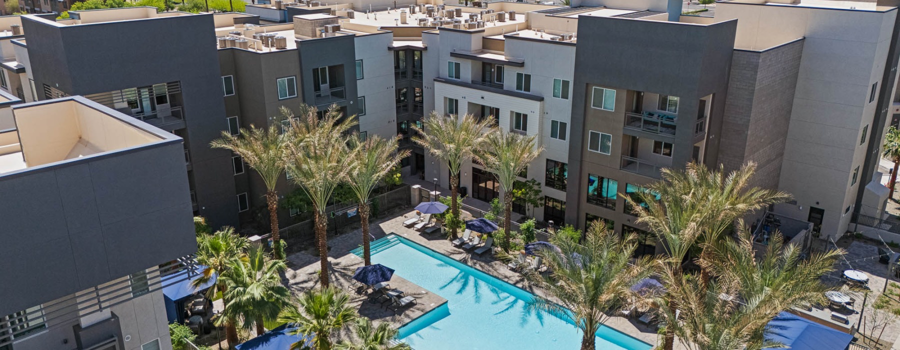 Exterior building with trees and resort style pool