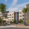 a building with palm trees and people walking on the sidewalk